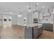 Modern kitchen with white and gray cabinets and a large island at 318 Abercom Place Dr, Moncks Corner, SC 29461