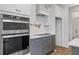Stainless steel appliances and a pot filler faucet in this stylish kitchen at 318 Abercom Place Dr, Moncks Corner, SC 29461