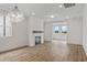 Bright living room with hardwood floors and a modern fireplace at 318 Abercom Place Dr, Moncks Corner, SC 29461