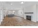 Open concept living room with hardwood floors and kitchen island visible at 318 Abercom Place Dr, Moncks Corner, SC 29461