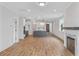 Open concept living area with hardwood floors and kitchen at 318 Abercom Place Dr, Moncks Corner, SC 29461