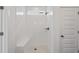 Clean and spacious walk-in shower with white tile and built-in bench at 318 Abercom Place Dr, Moncks Corner, SC 29461