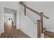 Elegant staircase with white spindles and hardwood floors at 318 Abercom Place Dr, Moncks Corner, SC 29461