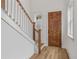 Elegant staircase with white spindles and hardwood floors at 318 Abercom Place Dr, Moncks Corner, SC 29461