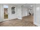 Sunroom with French doors leading to the backyard and a view into the kitchen at 318 Abercom Place Dr, Moncks Corner, SC 29461