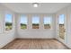Sunroom with hardwood floors and multiple windows offering natural light at 318 Abercom Place Dr, Moncks Corner, SC 29461