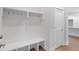 White built-in bench with storage and coat hooks at 364 Trailmore Ln, Summerville, SC 29486