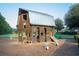 Wooden barn-themed playground with slide at 437 Parish Farms Dr, Summerville, SC 29486