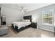 Main bedroom with ceiling fan, large bed, and plenty of natural light at 4857 Oak Leaf Rd, Summerville, SC 29485