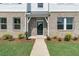 Inviting front entrance with a black door and brick accents at 5140 Double Eagle, Summerville, SC 29485