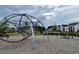 Modern playground with climbing ropes and swings at 719 Rumbling Leaf Ln, Summerville, SC 29486
