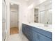 Modern bathroom with double vanity, blue cabinets, and marble flooring at 744 Blueway Ave, Summerville, SC 29486