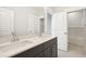 Bathroom with double vanity, dark cabinets, and white quartz countertop at 744 Blueway Ave, Summerville, SC 29486