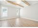 Spacious bedroom with wood-look flooring and two bright windows at 744 Blueway Ave, Summerville, SC 29486