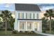 Two-story home with light gray siding, green shutters, and a front porch at 744 Blueway Ave, Summerville, SC 29486