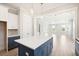 Modern kitchen with an island, white and blue cabinets at 744 Blueway Ave, Summerville, SC 29486