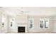 Bright living room with fireplace and hardwood floors at 744 Blueway Ave, Summerville, SC 29486