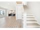 Bright entryway with elegant staircase and view of kitchen at 744 Blueway Ave, Summerville, SC 29486