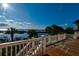 Spacious deck with white railings and ocean views at 75 Lost Village Trl, Edisto Island, SC 29438