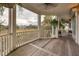 Spacious screened porch with marsh views and ceiling fan at 8 Seagrass Ln, Isle of Palms, SC 29451