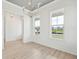 Bright dining room with hardwood floors, chandelier, and view of the neighborhood at 825 Gentle Breeze Dr, Summerville, SC 29486