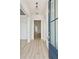 Bright entryway with light hardwood floors, a navy blue door, and chandelier at 825 Gentle Breeze Dr, Summerville, SC 29486