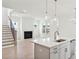 Kitchen with island, white cabinets, and stainless steel appliances at 825 Gentle Breeze Dr, Summerville, SC 29486
