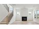 Spacious living room with fireplace and hardwood floors at 825 Gentle Breeze Dr, Summerville, SC 29486