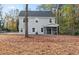 Gray house with screened porch and tree-filled backyard at 927 Long Point Rd, Mount Pleasant, SC 29464