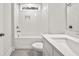 Clean bathroom, white subway tiles, bathtub, and quartz vanity at 929 Long Point Rd, Mount Pleasant, SC 29464