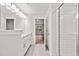Modern bathroom with double vanity and access to bedroom at 929 Long Point Rd, Mount Pleasant, SC 29464