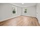 Bright bedroom with hardwood floors and two large windows at 929 Long Point Rd, Mount Pleasant, SC 29464