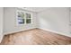 Spacious bedroom featuring hardwood floors and a large window at 929 Long Point Rd, Mount Pleasant, SC 29464