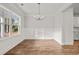 Bright dining room with hardwood floors and white wainscoting at 929 Long Point Rd, Mount Pleasant, SC 29464