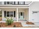 Front entrance with light teal door and white columns at 929 Long Point Rd, Mount Pleasant, SC 29464