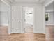 Hallway with hardwood floors and access to bathroom and bedrooms at 929 Long Point Rd, Mount Pleasant, SC 29464