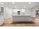 Kitchen island with white shiplap and quartz countertop at 929 Long Point Rd, Mount Pleasant, SC 29464