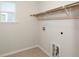 Laundry room with overhead shelving and space for a washer and dryer at 108 Loon Dr, Summerville, SC 29483