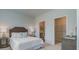 Bright bedroom with a comfortable bed, neutral decor, and an ensuite bathroom at 123 River Hill Rd, Goose Creek, SC 29445