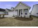 Tan house with white columns and landscaping at 1307 Black Skimmer St, Summerville, SC 29485