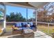 Relaxing screened porch with seating and a view of the backyard at 1320 Raven Rd, Hanahan, SC 29410