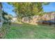 Fenced backyard with grassy area and surfboard storage at 1328 Cottonwood St, Charleston, SC 29403