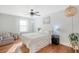 Cozy bedroom with hardwood floors, ceiling fan, and ample natural light at 1328 Cottonwood St, Charleston, SC 29403