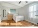 Simple bedroom with hardwood floors, a full-size bed, and a dresser at 1328 Cottonwood St, Charleston, SC 29403