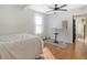 Bright bedroom with hardwood floors, a bed and a standing desk at 1328 Cottonwood St, Charleston, SC 29403