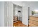 White closet with wood shelving and a hanging rod at 1328 Cottonwood St, Charleston, SC 29403