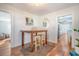 Small dining area with rustic wooden table and two stools at 1328 Cottonwood St, Charleston, SC 29403