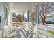 Relaxing front porch with white railings and comfortable seating at 1328 Cottonwood St, Charleston, SC 29403