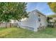 Side view of the white cottage with a small yard at 1328 Cottonwood St, Charleston, SC 29403