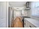 Modern kitchen featuring stainless steel appliances and hardwood floors at 1328 Cottonwood St, Charleston, SC 29403